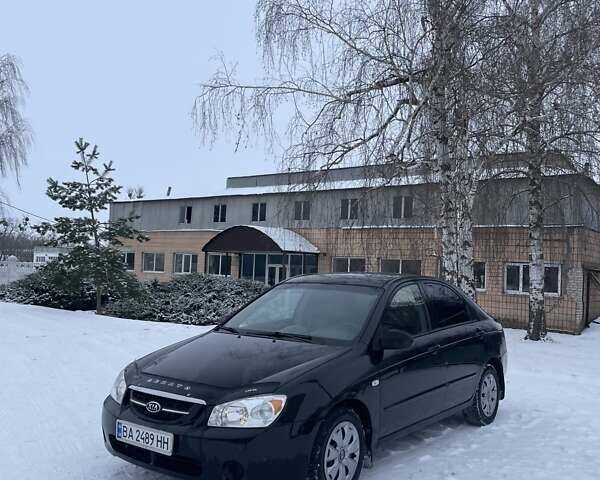 Черный Киа Черато, объемом двигателя 1.6 л и пробегом 305 тыс. км за 3999 $, фото 1 на Automoto.ua