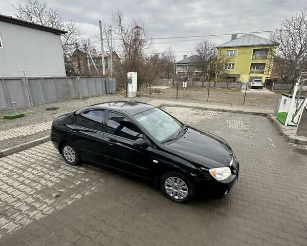 Черный Киа Черато, объемом двигателя 1.6 л и пробегом 210 тыс. км за 4500 $, фото 1 на Automoto.ua