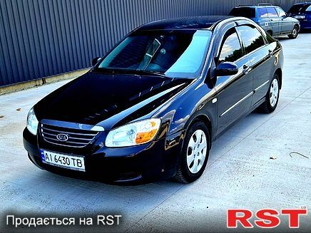 Черный Киа Черато, объемом двигателя 1.6 л и пробегом 300 тыс. км за 4000 $, фото 1 на Automoto.ua