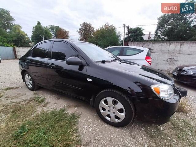 Черный Киа Черато, объемом двигателя 1.59 л и пробегом 203 тыс. км за 4400 $, фото 1 на Automoto.ua