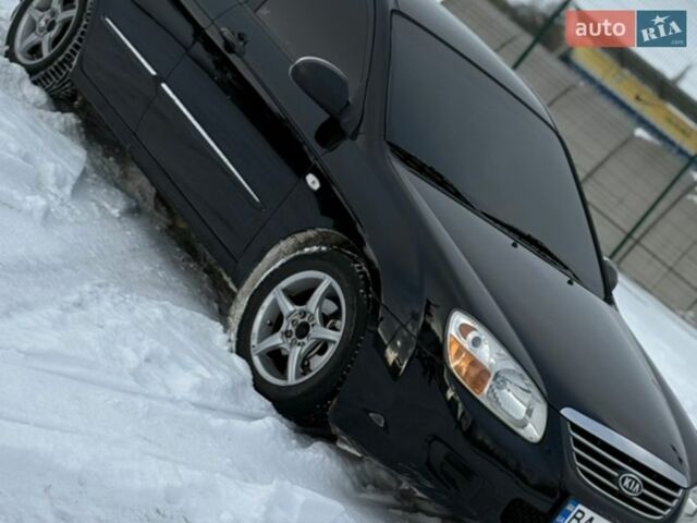 Черный Киа Черато, объемом двигателя 1.59 л и пробегом 227 тыс. км за 5100 $, фото 1 на Automoto.ua