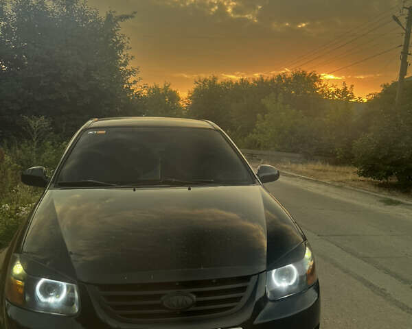 Черный Киа Черато, объемом двигателя 1.59 л и пробегом 314 тыс. км за 5000 $, фото 1 на Automoto.ua