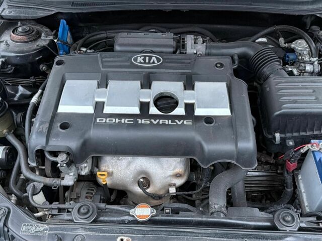 Черный Киа Черато, объемом двигателя 1.6 л и пробегом 220 тыс. км за 3300 $, фото 1 на Automoto.ua