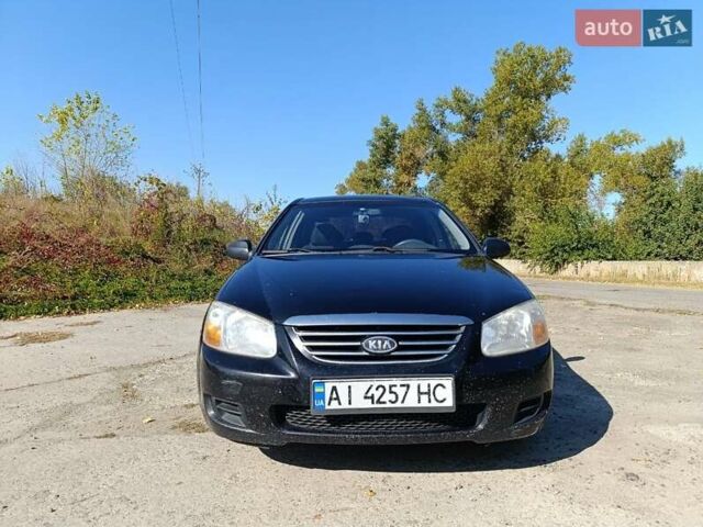 Черный Киа Черато, объемом двигателя 1.6 л и пробегом 322 тыс. км за 3000 $, фото 1 на Automoto.ua