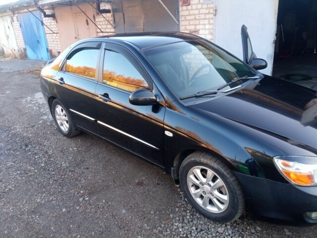 Черный Киа Черато, объемом двигателя 1.6 л и пробегом 129 тыс. км за 3300 $, фото 1 на Automoto.ua