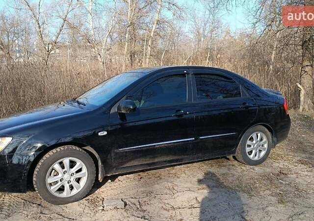 Черный Киа Черато, объемом двигателя 1.98 л и пробегом 174 тыс. км за 5900 $, фото 1 на Automoto.ua