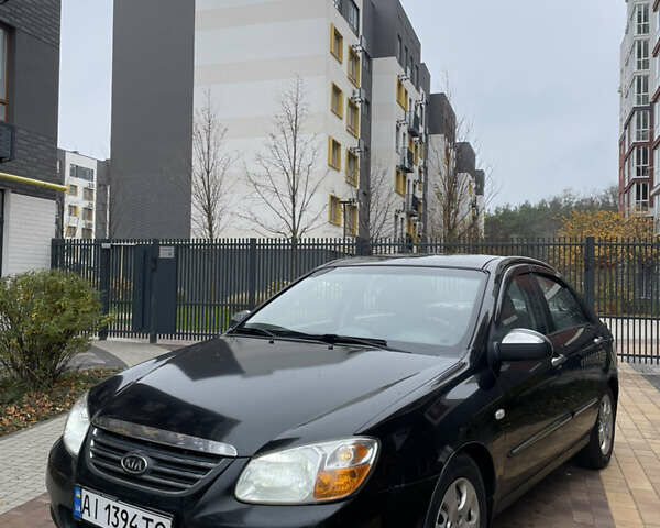 Черный Киа Черато, объемом двигателя 1.6 л и пробегом 256 тыс. км за 4000 $, фото 1 на Automoto.ua