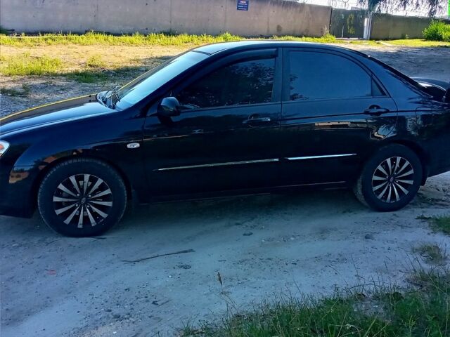 Чорний Кіа Черато, об'ємом двигуна 2 л та пробігом 203 тис. км за 5500 $, фото 1 на Automoto.ua