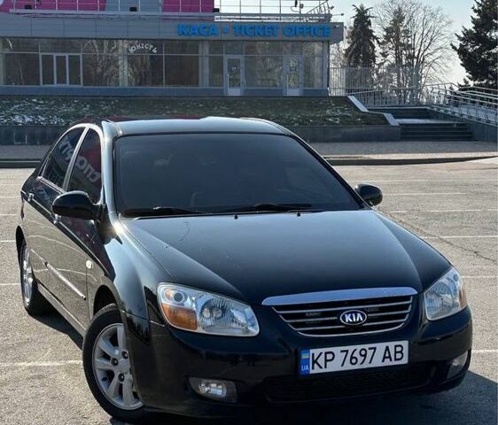 Черный Киа Черато, объемом двигателя 1.6 л и пробегом 247 тыс. км за 5100 $, фото 1 на Automoto.ua