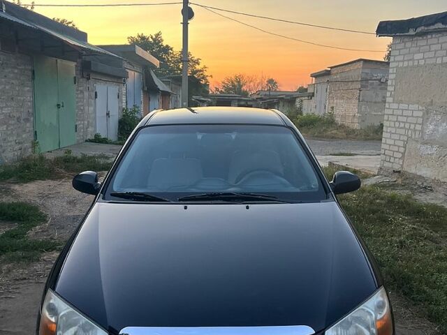 Чорний Кіа Черато, об'ємом двигуна 2 л та пробігом 342 тис. км за 3600 $, фото 1 на Automoto.ua