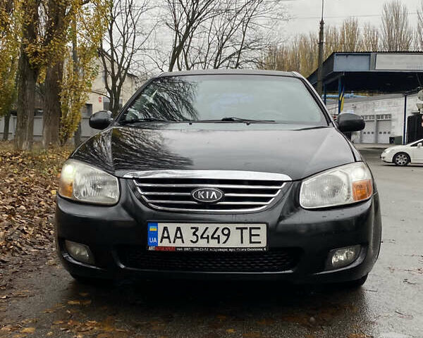 Черный Киа Черато, объемом двигателя 1.98 л и пробегом 306 тыс. км за 3800 $, фото 1 на Automoto.ua