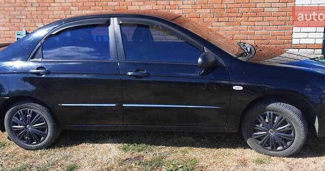 Черный Киа Черато, объемом двигателя 1.6 л и пробегом 277 тыс. км за 4200 $, фото 1 на Automoto.ua