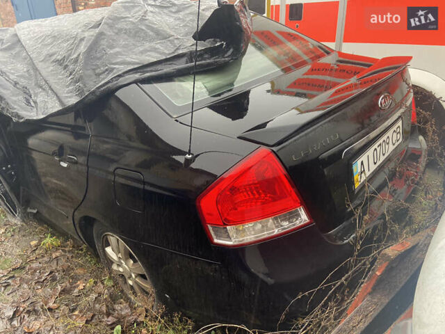 Черный Киа Черато, объемом двигателя 1.98 л и пробегом 95 тыс. км за 1650 $, фото 1 на Automoto.ua