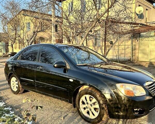 Черный Киа Черато, объемом двигателя 1.59 л и пробегом 305 тыс. км за 3800 $, фото 1 на Automoto.ua