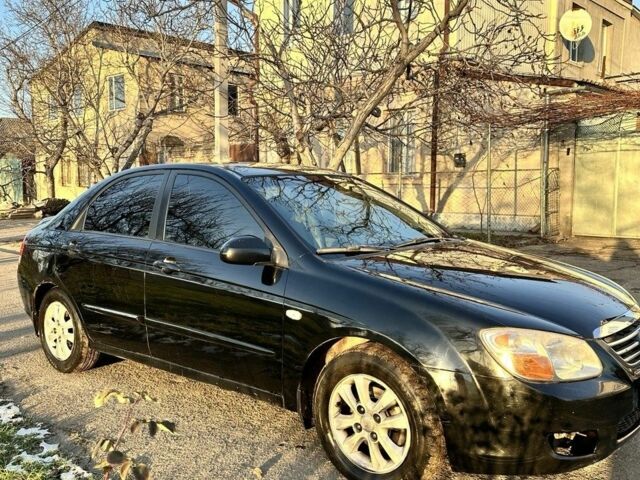 Черный Киа Черато, объемом двигателя 1.6 л и пробегом 305 тыс. км за 3700 $, фото 1 на Automoto.ua