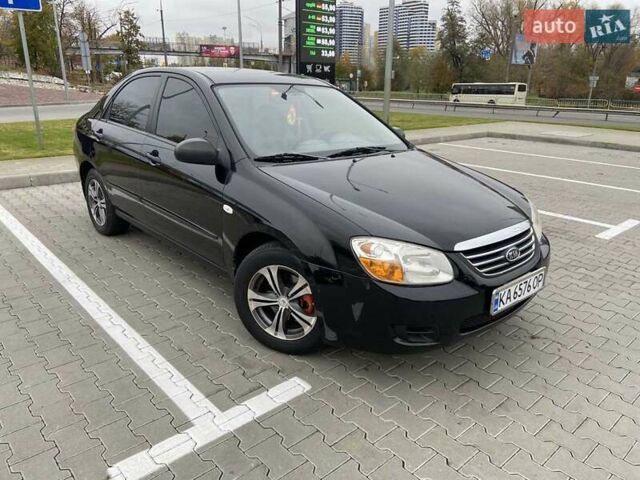 Черный Киа Черато, объемом двигателя 1.6 л и пробегом 200 тыс. км за 4000 $, фото 1 на Automoto.ua