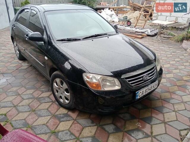 Черный Киа Черато, объемом двигателя 1.6 л и пробегом 260 тыс. км за 3800 $, фото 1 на Automoto.ua