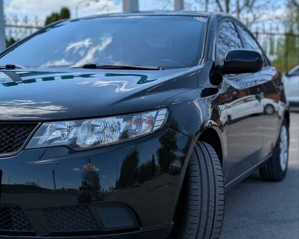 Чорний Кіа Черато, об'ємом двигуна 1.6 л та пробігом 175 тис. км за 7300 $, фото 1 на Automoto.ua