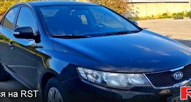 Черный Киа Черато, объемом двигателя 1.6 л и пробегом 300 тыс. км за 4999 $, фото 1 на Automoto.ua