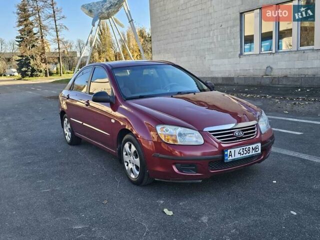 Красный Киа Черато, объемом двигателя 1.6 л и пробегом 200 тыс. км за 2600 $, фото 1 на Automoto.ua