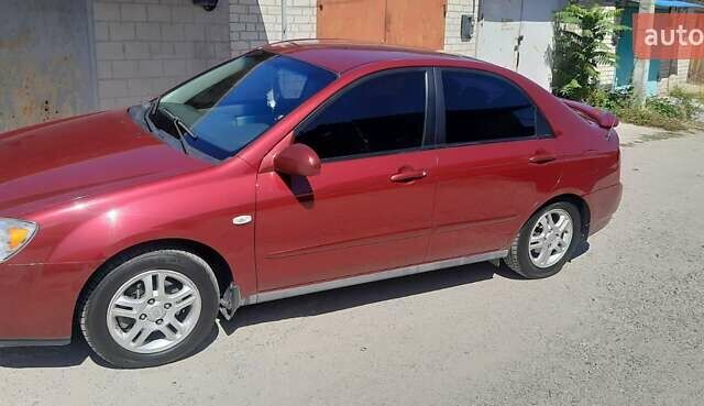 Красный Киа Черато, объемом двигателя 2 л и пробегом 144 тыс. км за 5400 $, фото 1 на Automoto.ua