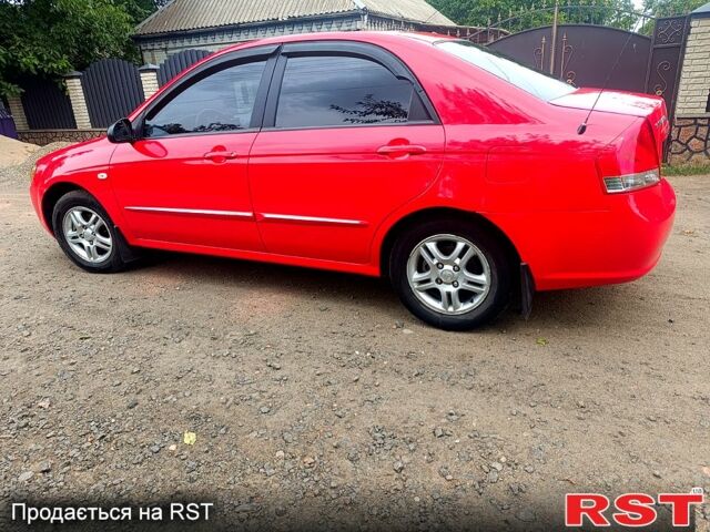 Красный Киа Черато, объемом двигателя 1.6 л и пробегом 230 тыс. км за 4600 $, фото 1 на Automoto.ua