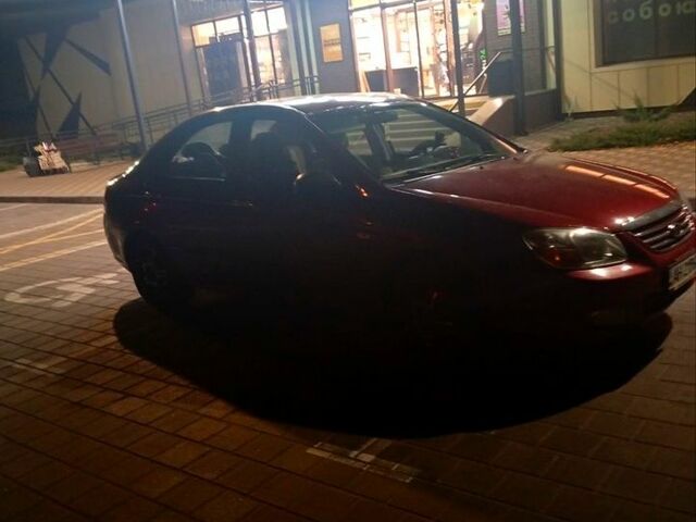 Красный Киа Черато, объемом двигателя 1.6 л и пробегом 150 тыс. км за 4000 $, фото 1 на Automoto.ua