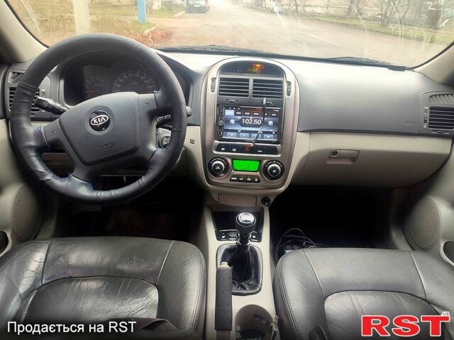 Серый Киа Черато, объемом двигателя 1.5 л и пробегом 250 тыс. км за 4000 $, фото 1 на Automoto.ua