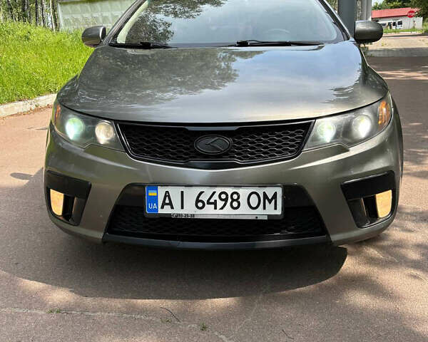 Серый Киа Черато, объемом двигателя 2 л и пробегом 212 тыс. км за 5999 $, фото 1 на Automoto.ua