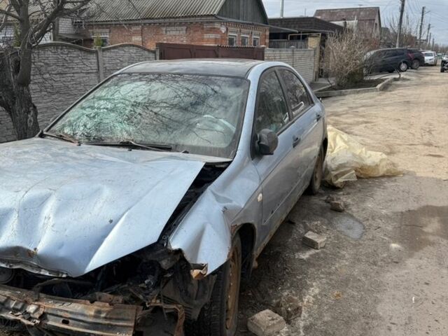 Серый Киа Черато, объемом двигателя 2 л и пробегом 350 тыс. км за 900 $, фото 1 на Automoto.ua