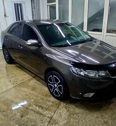 Серый Киа Черато, объемом двигателя 2 л и пробегом 250 тыс. км за 7200 $, фото 1 на Automoto.ua