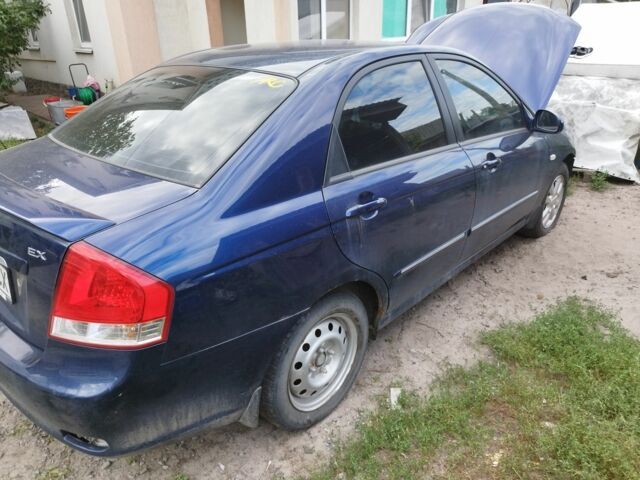 Синій Кіа Черато, об'ємом двигуна 2 л та пробігом 113 тис. км за 2302 $, фото 1 на Automoto.ua