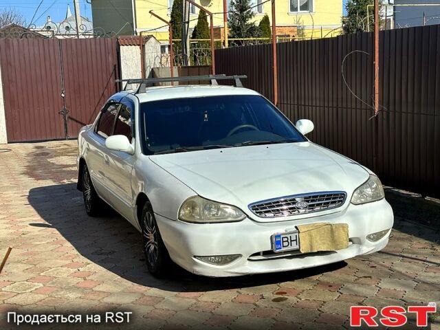 Белый Киа Кларус, объемом двигателя 1.6 л и пробегом 250 тыс. км за 2200 $, фото 1 на Automoto.ua