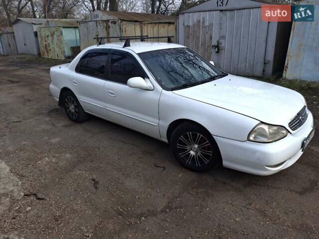 Белый Киа Кларус, объемом двигателя 2 л и пробегом 285 тыс. км за 2100 $, фото 1 на Automoto.ua