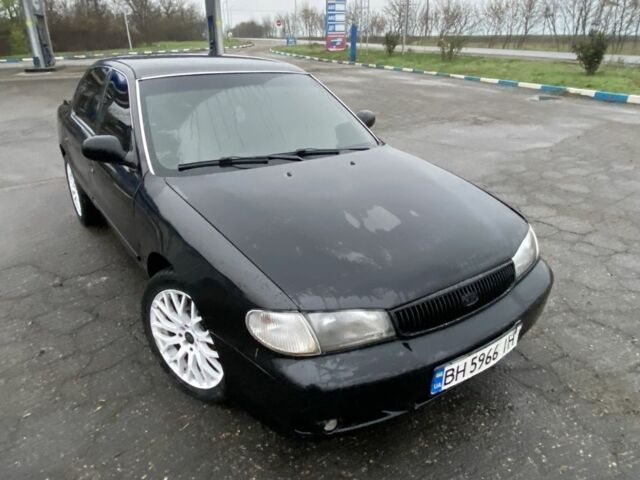 Чорний Кіа Кларус, об'ємом двигуна 2 л та пробігом 300 тис. км за 1600 $, фото 1 на Automoto.ua