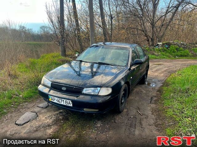 Черный Киа Кларус, объемом двигателя 2 л и пробегом 250 тыс. км за 999 $, фото 1 на Automoto.ua