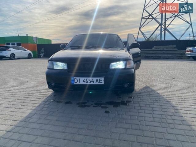 Черный Киа Кларус, объемом двигателя 1.98 л и пробегом 309 тыс. км за 1900 $, фото 1 на Automoto.ua