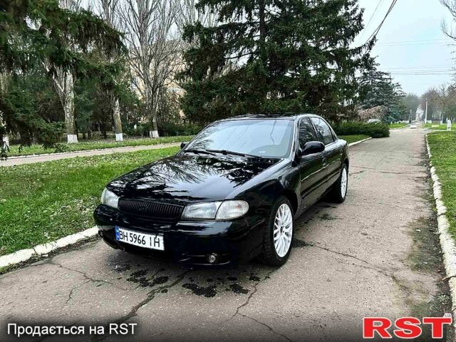 Черный Киа Кларус, объемом двигателя 2 л и пробегом 300 тыс. км за 1850 $, фото 1 на Automoto.ua