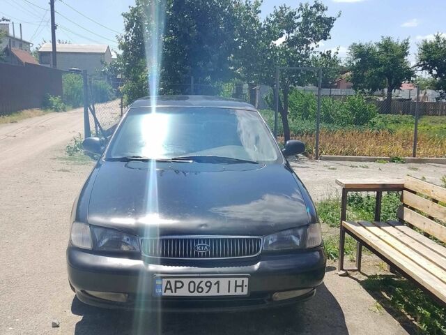 Чорний Кіа Кларус, об'ємом двигуна 2 л та пробігом 200 тис. км за 961 $, фото 1 на Automoto.ua