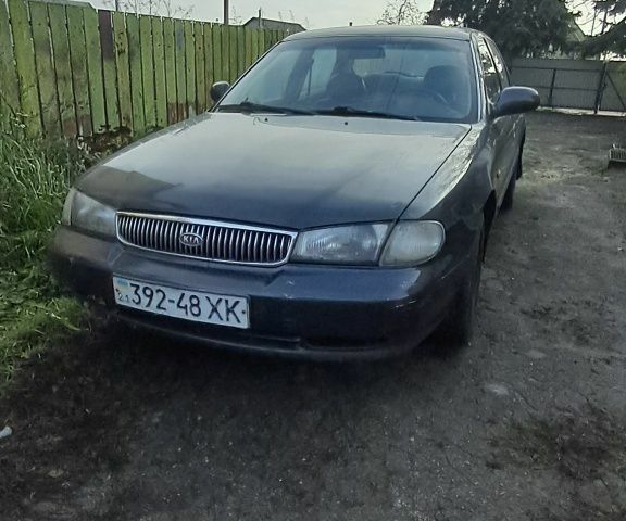 Черный Киа Кларус, объемом двигателя 2 л и пробегом 250 тыс. км за 850 $, фото 1 на Automoto.ua