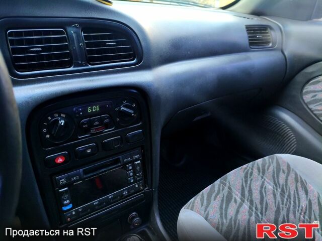 Чорний Кіа Кларус, об'ємом двигуна 2 л та пробігом 218 тис. км за 2700 $, фото 1 на Automoto.ua