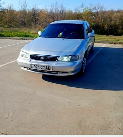Серый Киа Кларус, объемом двигателя 2 л и пробегом 400 тыс. км за 1100 $, фото 1 на Automoto.ua