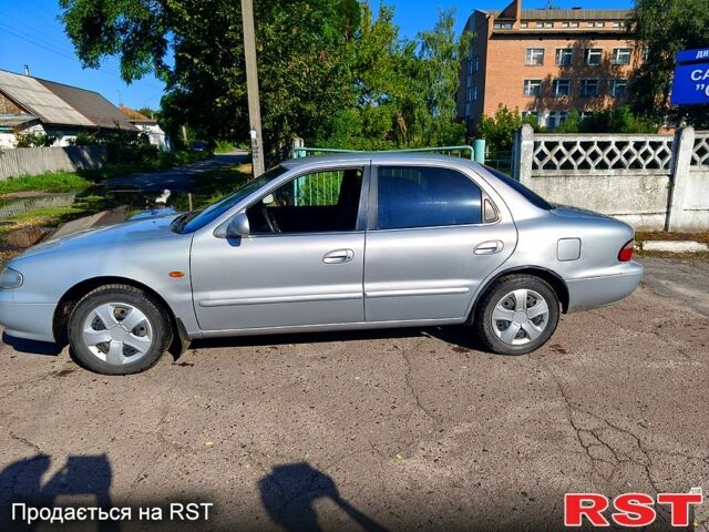 Сірий Кіа Кларус, об'ємом двигуна 20 л та пробігом 248 тис. км за 2150 $, фото 1 на Automoto.ua