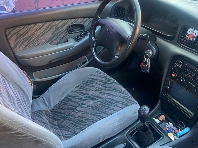 Сірий Кіа Кларус, об'ємом двигуна 2 л та пробігом 169 тис. км за 701 $, фото 1 на Automoto.ua