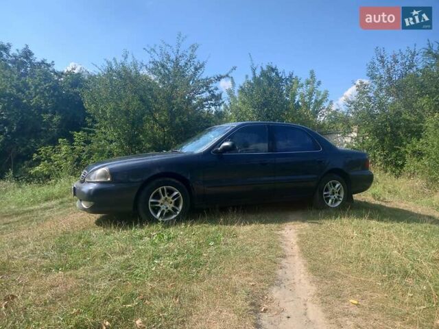 Серый Киа Кларус, объемом двигателя 2 л и пробегом 294 тыс. км за 1800 $, фото 1 на Automoto.ua