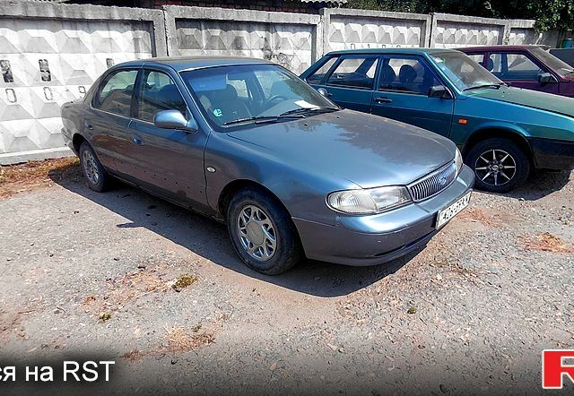 Сірий Кіа Кларус, об'ємом двигуна 2 л та пробігом 296 тис. км за 1100 $, фото 1 на Automoto.ua