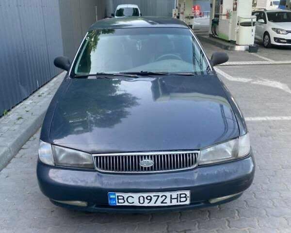 Синий Киа Кларус, объемом двигателя 2 л и пробегом 395 тыс. км за 2200 $, фото 1 на Automoto.ua