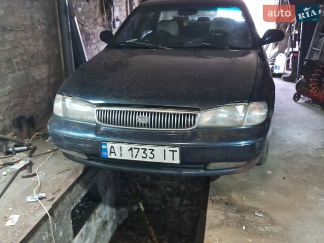 Синий Киа Кларус, объемом двигателя 2 л и пробегом 243 тыс. км за 1500 $, фото 1 на Automoto.ua