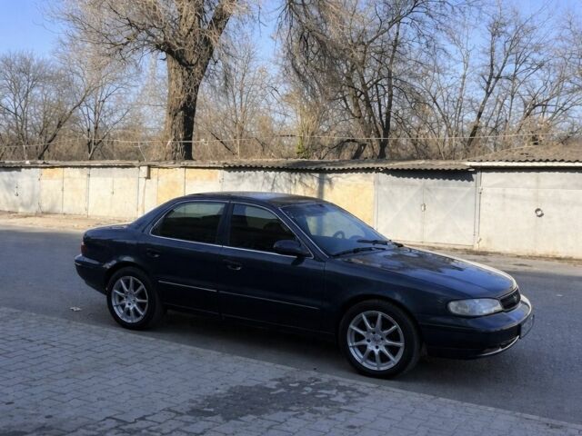 Синий Киа Кларус, объемом двигателя 2 л и пробегом 270 тыс. км за 1400 $, фото 1 на Automoto.ua