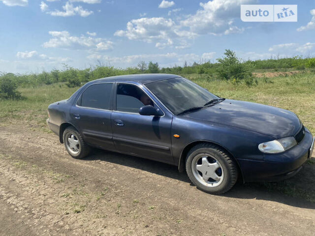 Синій Кіа Кларус, об'ємом двигуна 2 л та пробігом 200 тис. км за 2300 $, фото 1 на Automoto.ua